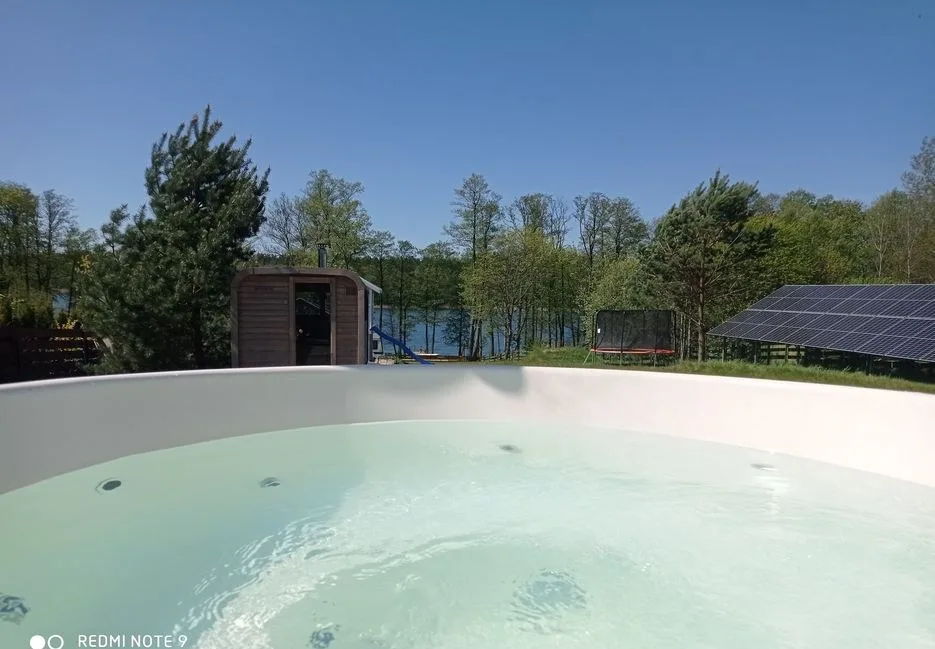 Całoroczny dom nad jeziorem SEN MAZUR z sauną, jacuzzi ,własną plażą